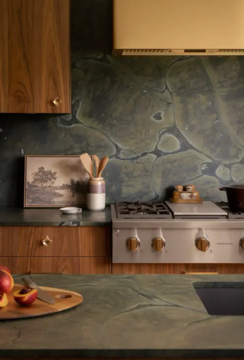Country kitchen interior design Ajloun Jordan   green marble backsplash walnut cabinetry brass details